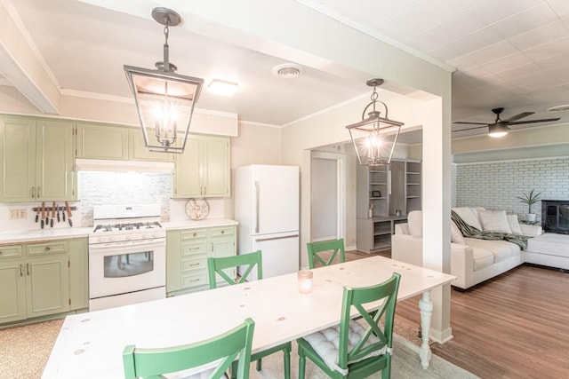 1408 W Clark St, Bartlett, TX 76511 - kitchen featuring white appliances, green cabinetry, crown molding, light countertops, and open floor plan