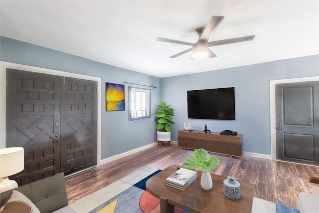 1408 W Clark St, Bartlett, TX 76511 - living room with baseboards, wood finished floors, and a ceiling fan