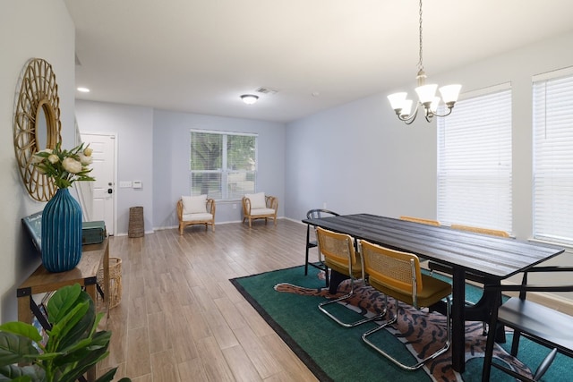 8716 Panadero Dr, Austin, TX 78747 - dining room with a chandelier, light wood-type flooring, and recessed lighting