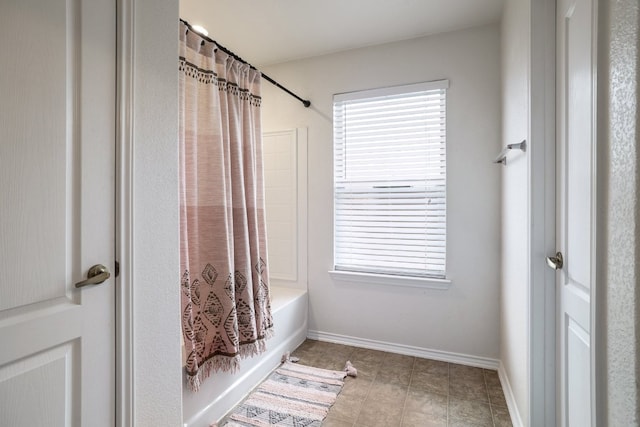 8716 Panadero Dr, Austin, TX 78747 - full bath featuring shower / tub combo with curtain and tile patterned flooring
