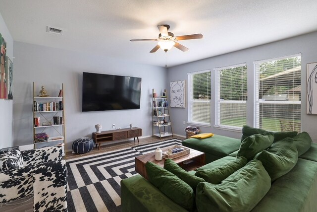 8716 Panadero Dr, Austin, TX 78747 - living room featuring ceiling fan and wood finished floors