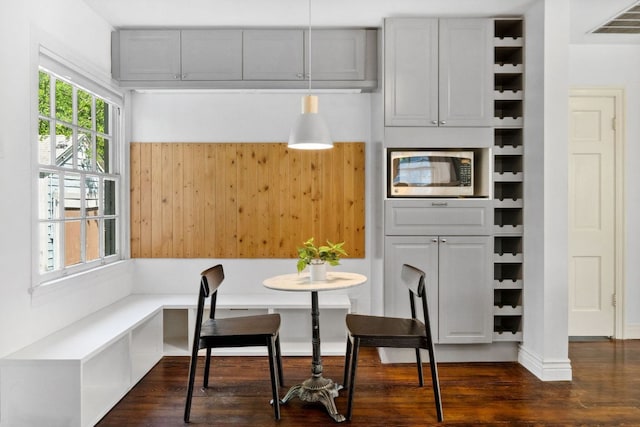 dining space with dark wood-type flooring