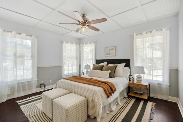 bedroom featuring wood finished floors, baseboards, and ceiling fan