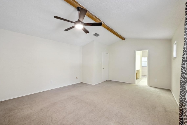 empty room with ceiling fan, light colored carpet, and baseboards