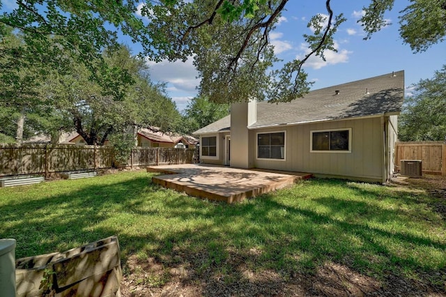 7201 Pine Bluffs Trl, Austin, TX 78729 - back of house featuring a shingled roof, central AC unit, and a patio