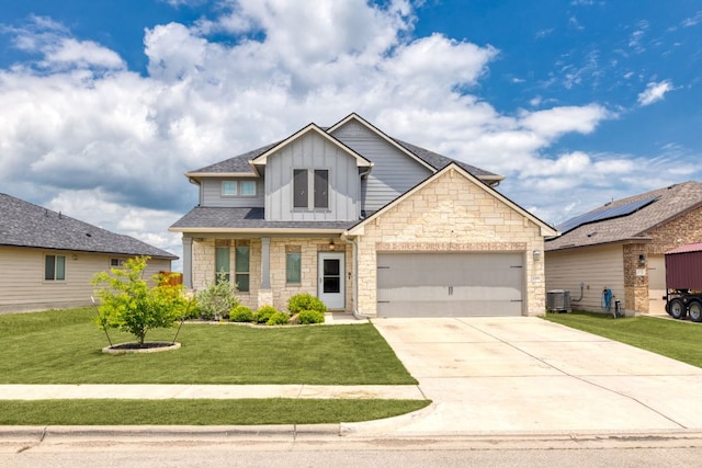 109 Reagor Dr, Taylor, TX 76574 - craftsman-style house with board and batten siding, stone siding, an attached garage, a front lawn, and driveway