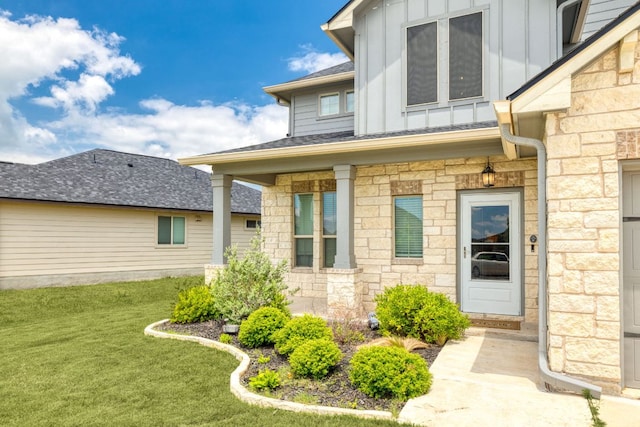 109 Reagor Dr, Taylor, TX 76574 - property entrance featuring board and batten siding, stone siding, a lawn, and roof with shingles