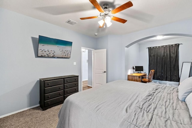 109 Reagor Dr, Taylor, TX 76574 - carpeted bedroom featuring arched walkways and a ceiling fan
