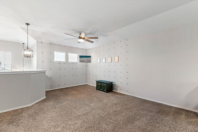109 Reagor Dr, Taylor, TX 76574 - empty room with carpet flooring, ceiling fan, and a chandelier