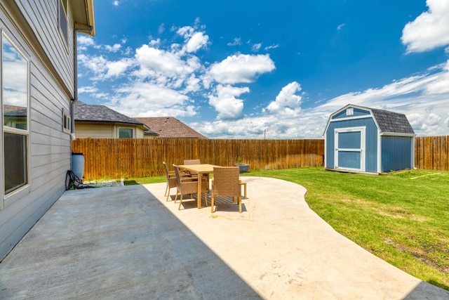 109 Reagor Dr, Taylor, TX 76574 - fenced backyard with a patio area, outdoor dining space, and a shed