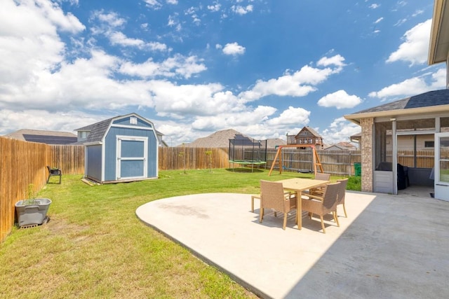 109 Reagor Dr, Taylor, TX 76574 - fenced backyard with a patio, a shed, a trampoline, a playground, and outdoor dining area