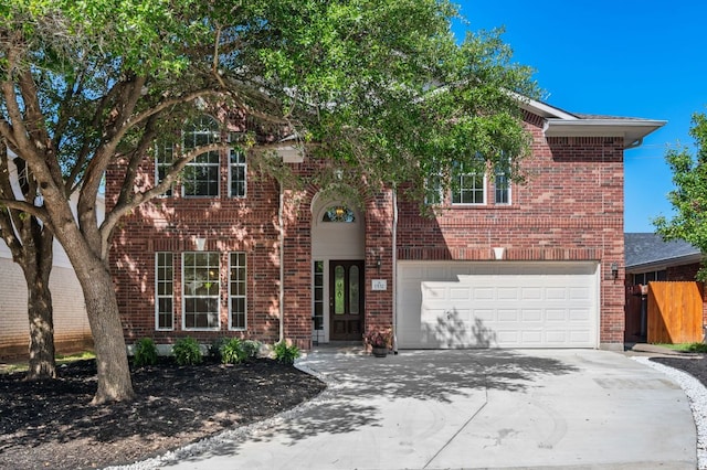 1532 Lorson Loop, Round Rock, TX 78665 - view of front of house with concrete driveway, brick siding, an attached garage, and fence
