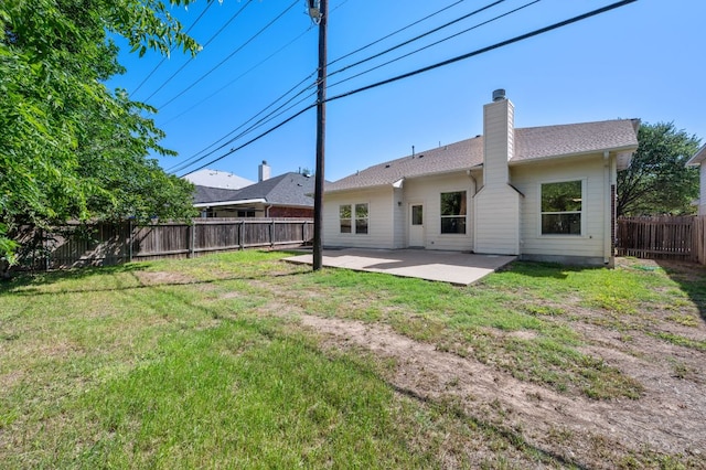 1532 Lorson Loop, Round Rock, TX 78665 - back of property with a patio and a chimney