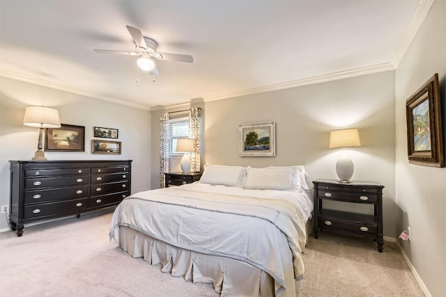carpeted bedroom with ornamental molding, baseboards, and a ceiling fan