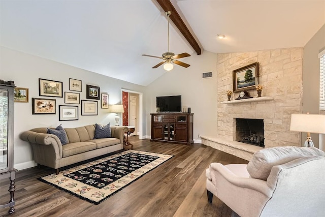 living room featuring a ceiling fan, dark wood-type flooring, beamed ceiling, a fireplace, and baseboards