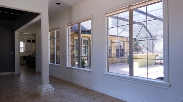 7228 Oak Shores Dr, Austin, TX 78730 - entryway featuring baseboards and stone tile flooring