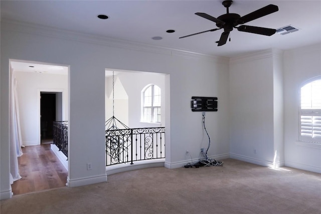 7228 Oak Shores Dr, Austin, TX 78730 - empty room with carpet floors, a ceiling fan, crown molding, and baseboards