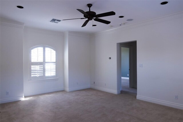 7228 Oak Shores Dr, Austin, TX 78730 - spare room featuring crown molding, light carpet, ceiling fan, and baseboards