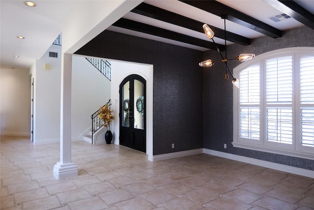 7228 Oak Shores Dr, Austin, TX 78730 - entryway featuring plenty of natural light, an accent wall, baseboards, beam ceiling, and stairs