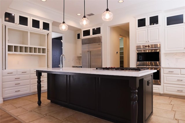 7228 Oak Shores Dr, Austin, TX 78730 - kitchen with stainless steel appliances, crown molding, an island with sink, light countertops, and open shelves