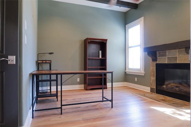 7228 Oak Shores Dr, Austin, TX 78730 - office with light wood-type flooring, baseboards, and a tiled fireplace
