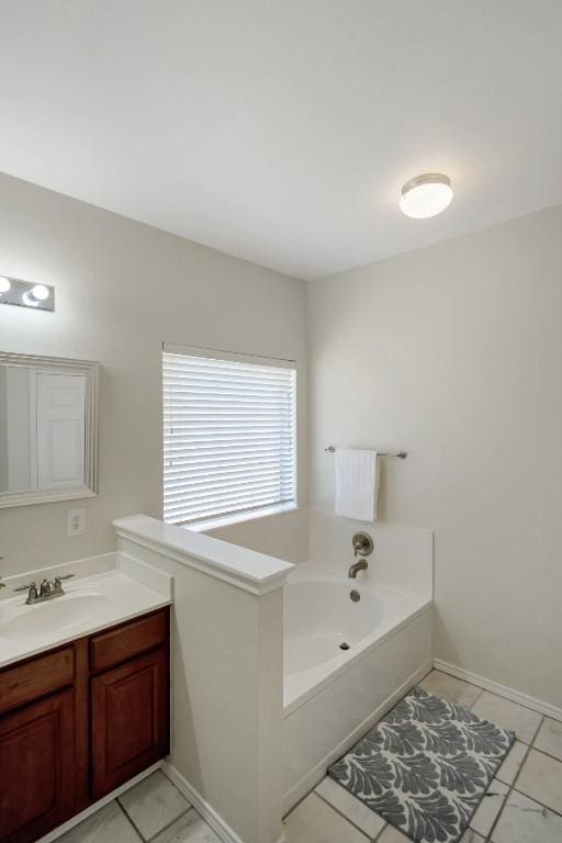 232 Housefinch Loop, Leander, TX 78641 - bathroom with vanity, a garden tub, and tile patterned floors