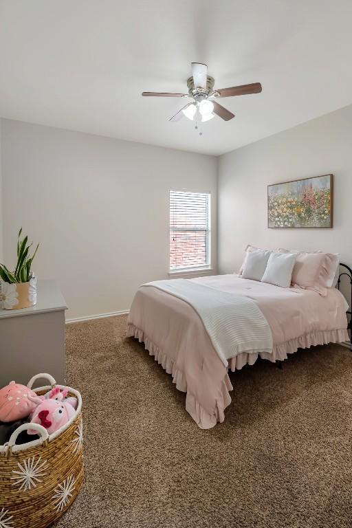 232 Housefinch Loop, Leander, TX 78641 - carpeted bedroom with baseboards and a ceiling fan