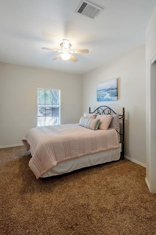 232 Housefinch Loop, Leander, TX 78641 - bedroom featuring carpet floors and ceiling fan