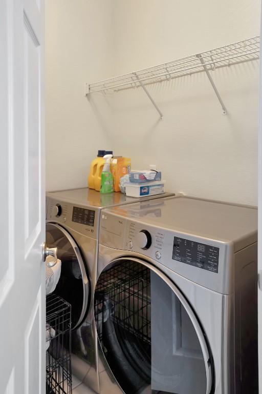 laundry area with separate washer and dryer