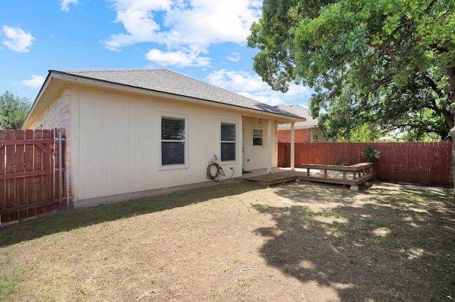 232 Housefinch Loop, Leander, TX 78641 - back of property featuring a fenced backyard and a deck