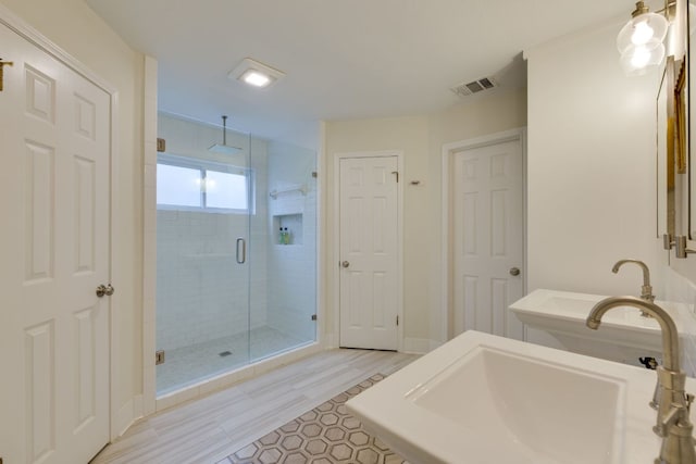 2403 Braemar Cv, Austin, TX 78747 - bathroom featuring a shower stall and a sink