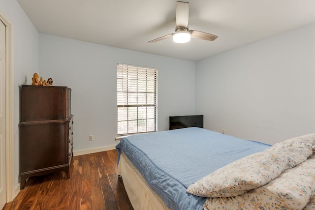 2403 Braemar Cv, Austin, TX 78747 - bedroom featuring dark wood-style floors, baseboards, and a ceiling fan