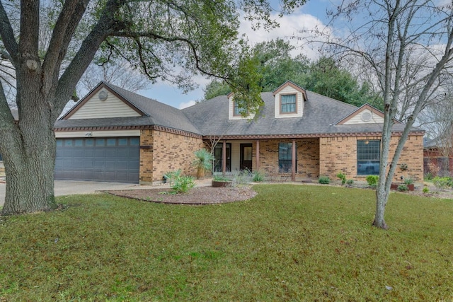2403 Braemar Cv, Austin, TX 78747 - view of front of home with brick siding, a garage, a front yard, driveway, and a shingled roof