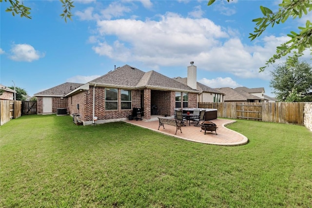 4216 Hannover Way, Round Rock, TX 78681 - back of property featuring a fire pit, brick siding, a chimney, a patio area, and a fenced backyard