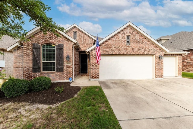 4216 Hannover Way, Round Rock, TX 78681 - view of front of home featuring a garage, driveway, and brick siding