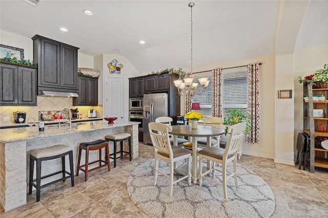 4216 Hannover Way, Round Rock, TX 78681 - dining room with a chandelier, vaulted ceiling, and recessed lighting
