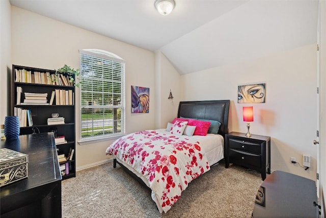 4216 Hannover Way, Round Rock, TX 78681 - bedroom featuring multiple windows, vaulted ceiling, and carpet flooring
