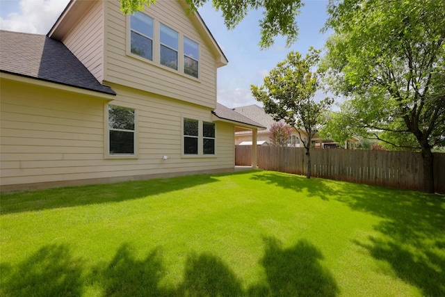 back of property with a shingled roof