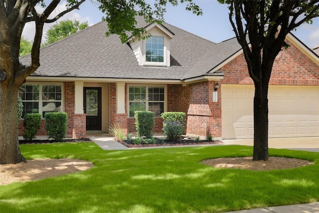 view of front facade featuring brick siding, roof with shingles, and a garage