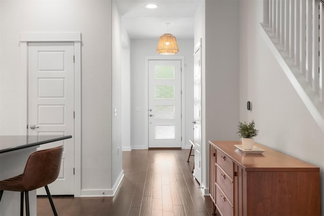 2204 Robert Browning St, Austin, TX 78723 - entrance foyer featuring baseboards, dark wood finished floors, and stairs