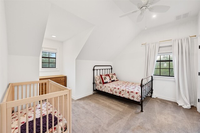 19905 Hamilton Pool Rd, Dripping Springs, TX 78620 - carpeted bedroom with vaulted ceiling, multiple windows, a ceiling fan, recessed lighting, and baseboards
