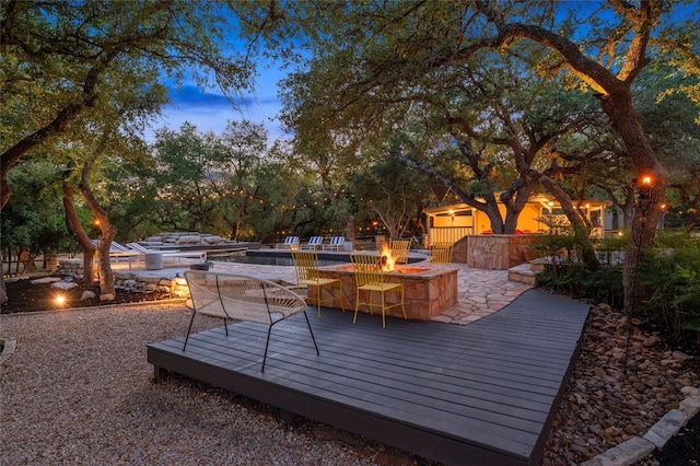 19905 Hamilton Pool Rd, Dripping Springs, TX 78620 - wooden deck with a fire pit