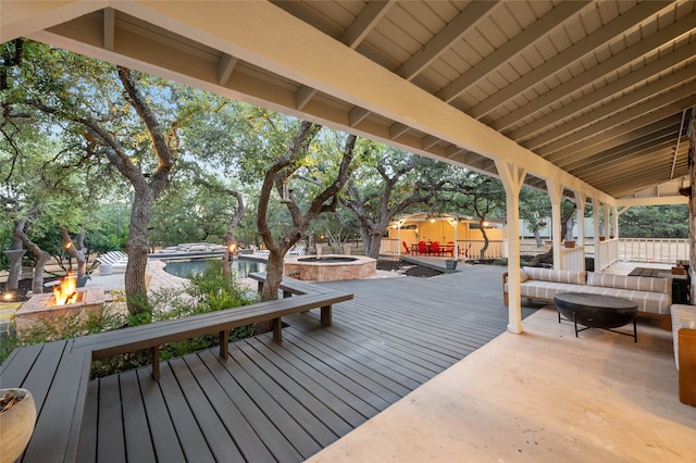 19905 Hamilton Pool Rd, Dripping Springs, TX 78620 - deck with an outdoor living space with a fire pit