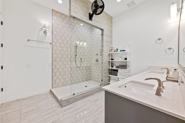 19905 Hamilton Pool Rd, Dripping Springs, TX 78620 - bathroom featuring double vanity, a tile shower, tile patterned flooring, and recessed lighting