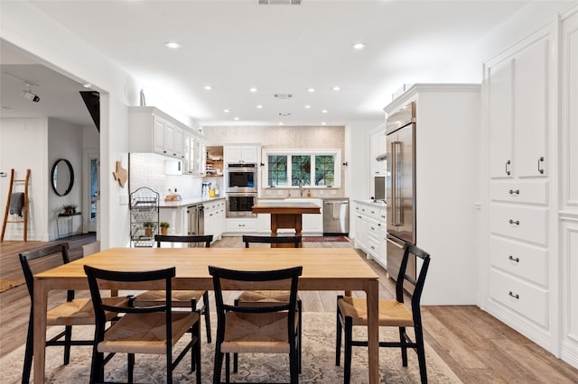 19905 Hamilton Pool Rd, Dripping Springs, TX 78620 - dining area with light wood finished floors and recessed lighting