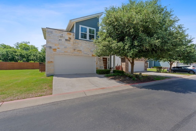view of front of home featuring stone siding, driveway, and an attached garage