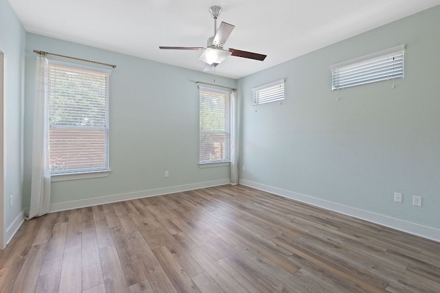 6008 Rubicon Run, Austin, TX 78745 - spare room featuring ceiling fan, wood finished floors, and baseboards