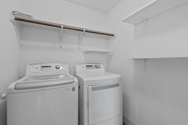 washroom with washing machine and dryer