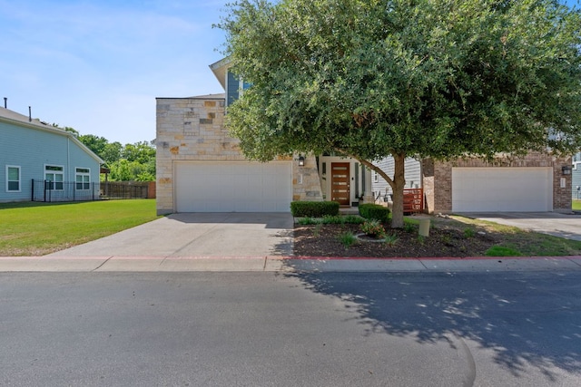 view of front of property featuring a garage, concrete driveway, and stone siding