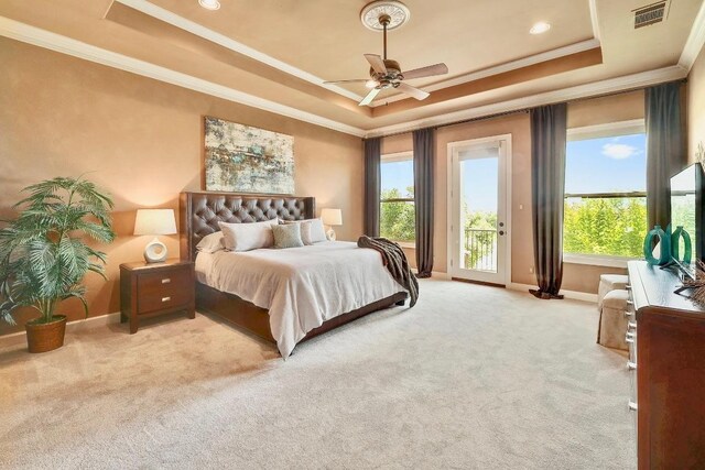 bedroom with a tray ceiling, crown molding, access to outside, baseboards, and light carpet